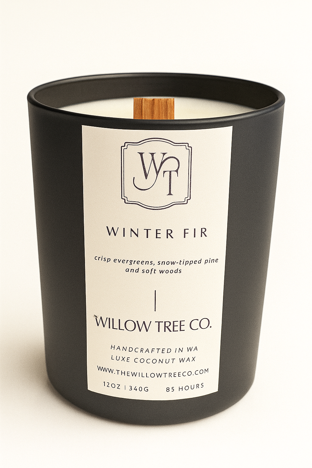 Black candle with a white label featuring 'Willow Tree Co.' on a white background