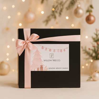 Black gift box with pink ribbon and 'Willow Tree Co.' label against a festive background