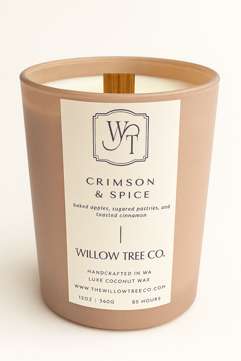 Candle with a label from Willow Tree Co. on a white background