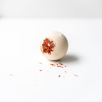 Bath bomb with saffron on a white background