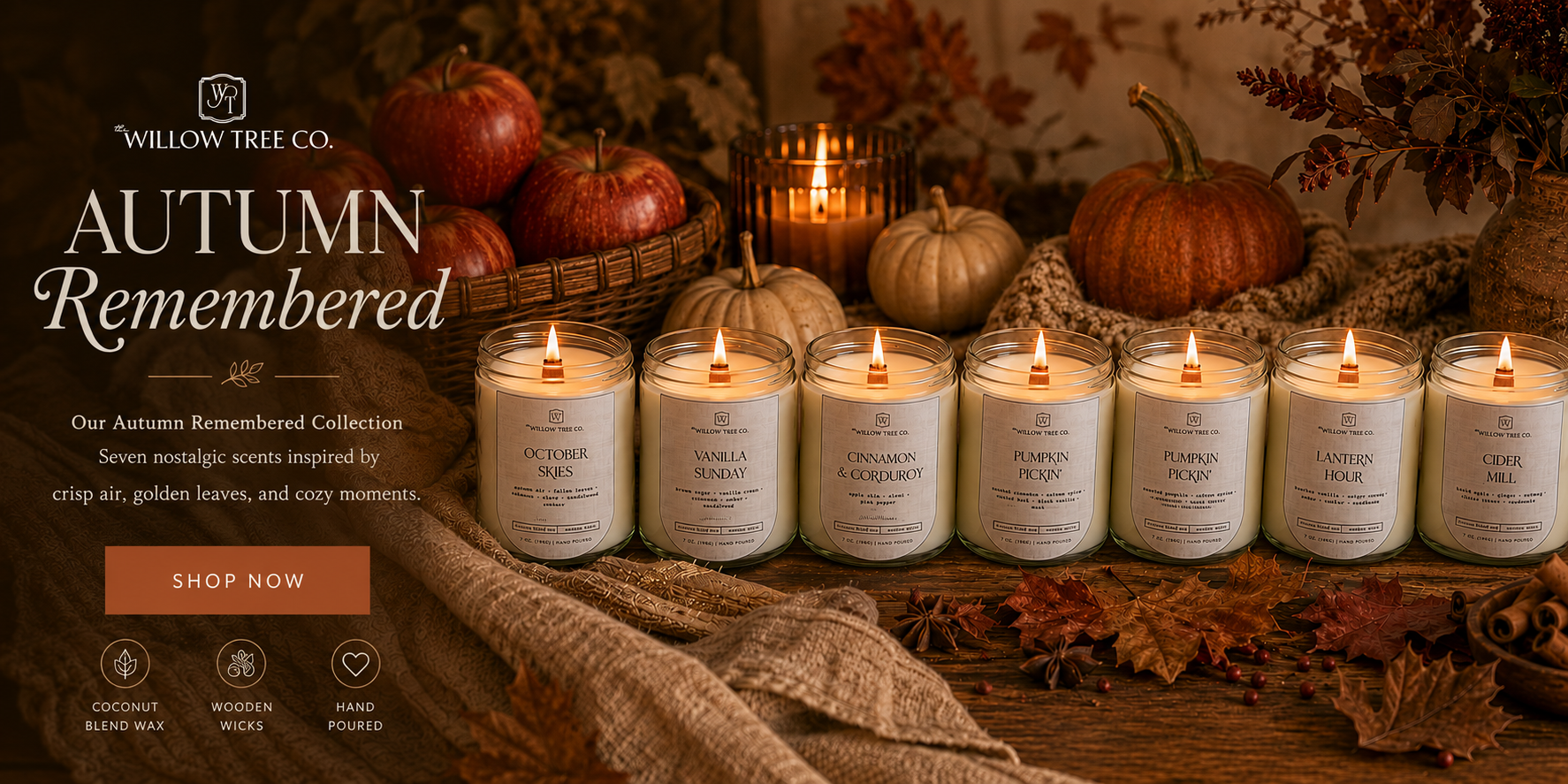 A promotional banner for Willow Tree Co. 'Autumn Remembered' scented candles, featuring seven lit glass jar candles lined up on a rustic table surrounded by pumpkins, fall leaves, and cozy autumn decor.