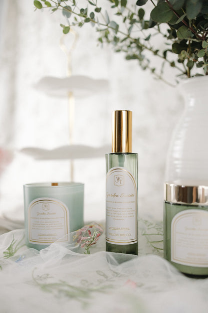 Three skincare products on a white surface with a blurred background