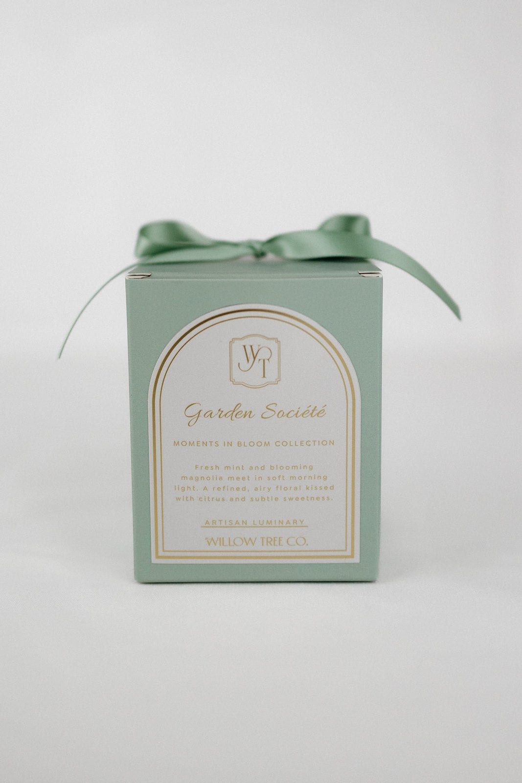 Green box with a bow and label on a light gray background