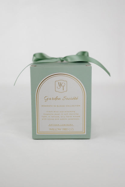 Green box with a bow and label on a light gray background