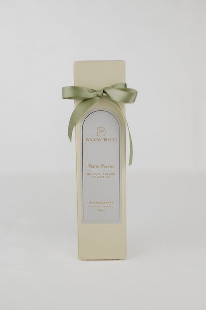 Gift box with a green ribbon on a white background