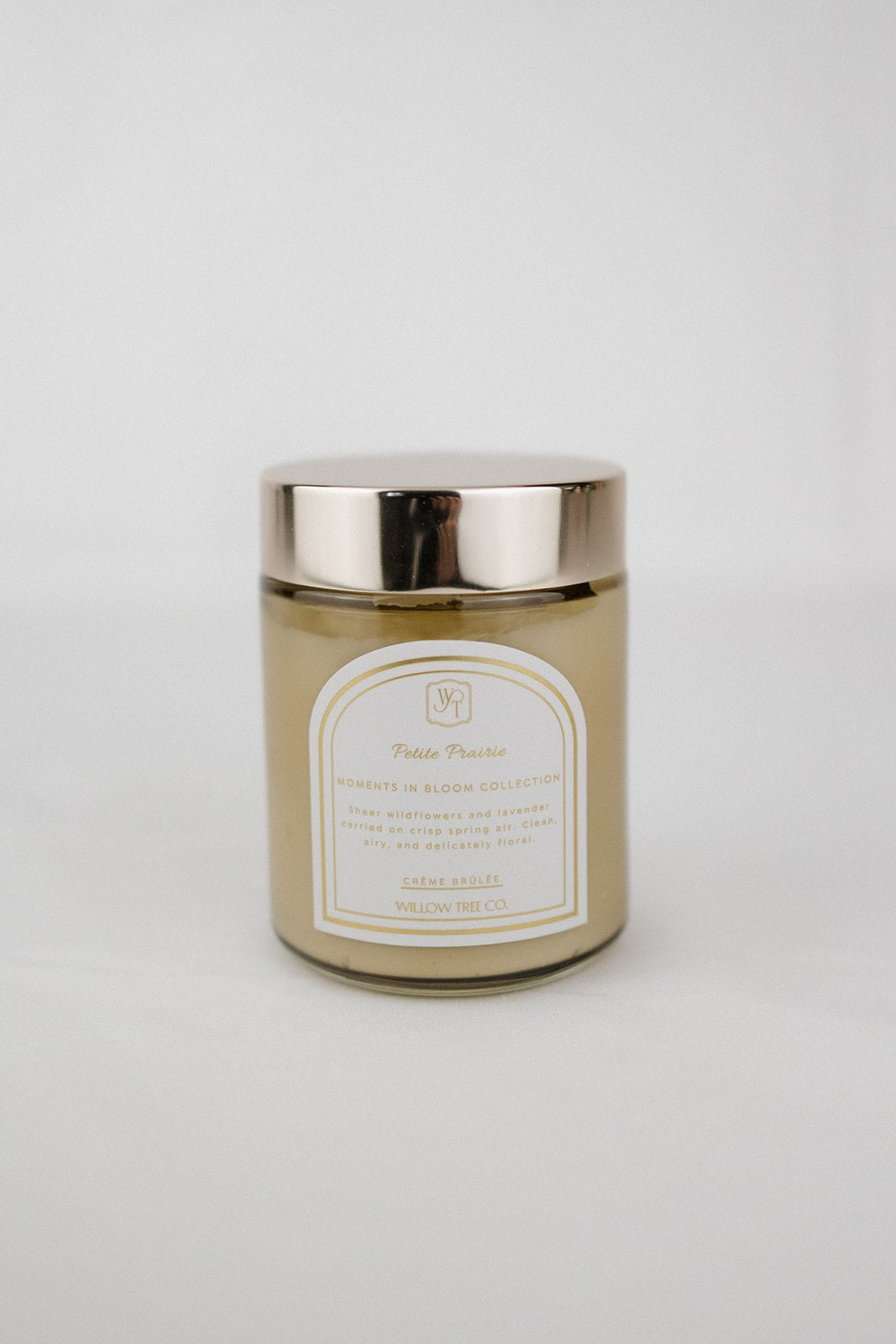 Body cream jar with a gold lid on a white background