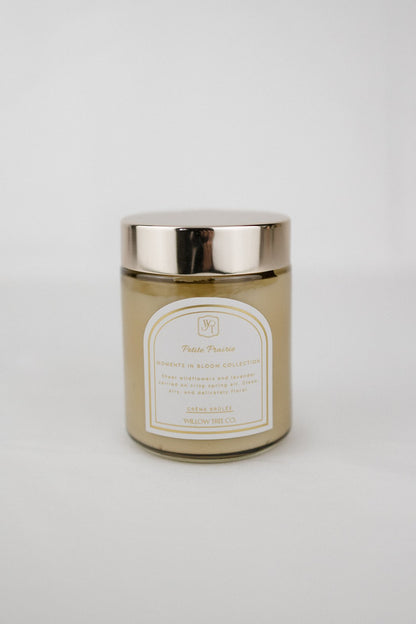Body cream jar with a gold lid on a white background