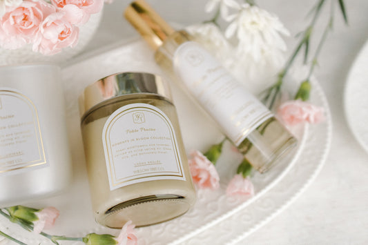Cosmetic products with floral elements on a white surface