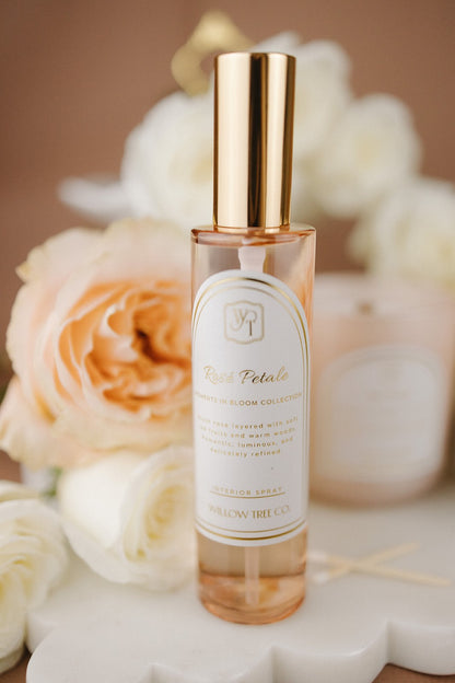 Perfume bottle with gold cap on a floral background