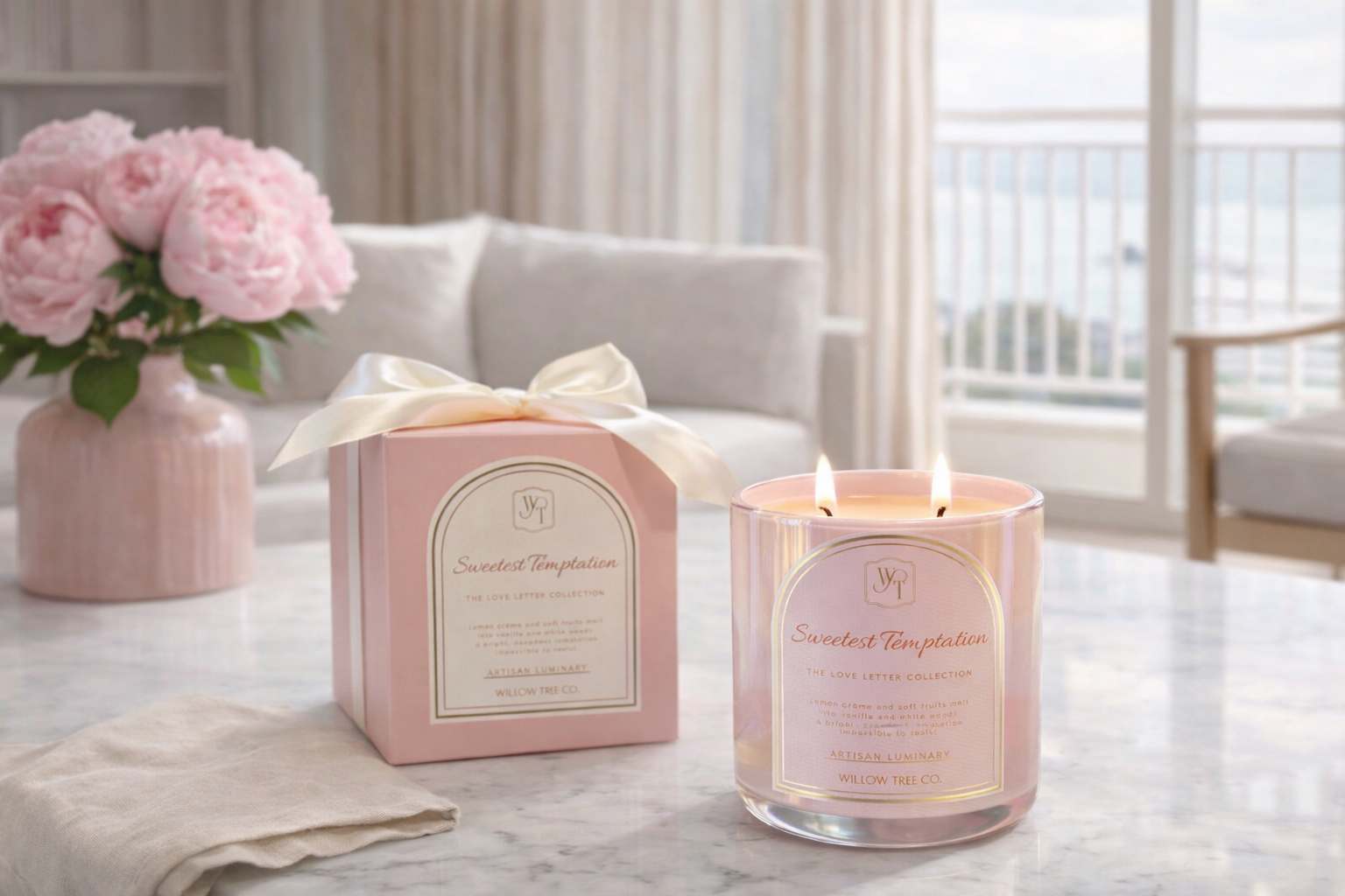Pink candle and packaging on a table with flowers in the background