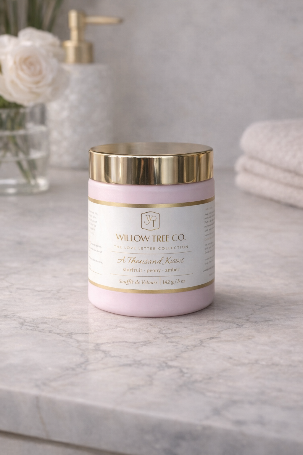 Pink jar with gold lid on a marble surface, featuring 'Willow Tree Co.' branding.